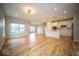 Open-concept living area featuring hardwood floors, recessed lighting, and a modern kitchen at 9455 Orchard Cove Dr, Indianapolis, IN 46239