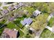 An aerial view shows this home in a mature neighborhood, with large trees, manicured lawns and sidewalks at 9944 Holaday Dr, Carmel, IN 46032