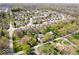 An aerial view shows this home in a mature neighborhood, with large trees, manicured lawns and sidewalks at 9944 Holaday Dr, Carmel, IN 46032