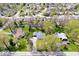 An aerial view shows this home in a mature neighborhood, with large trees, manicured lawns and sidewalks at 9944 Holaday Dr, Carmel, IN 46032