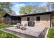 Outdoor deck with seating and grill area, perfect for entertaining and enjoying backyard views at 9944 Holaday Dr, Carmel, IN 46032