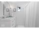 Bright bathroom featuring marble countertop and fresh white cabinets and shower at 9944 Holaday Dr, Carmel, IN 46032