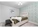 Charming bedroom with green leaf wallpaper and a cozy bed with built in storage at 9944 Holaday Dr, Carmel, IN 46032