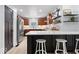 Bright kitchen with white subway tile backsplash, wood cabinets, and stainless steel appliances at 9944 Holaday Dr, Carmel, IN 46032