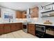 Updated kitchen with stainless steel appliances, gas range, and ample counter space at 9944 Holaday Dr, Carmel, IN 46032