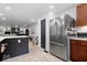 Spacious kitchen with stainless steel refrigerator and updated countertops at 9944 Holaday Dr, Carmel, IN 46032