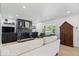 Bright living room featuring fireplace, built-ins, neutral paint, and hardwood flooring at 9944 Holaday Dr, Carmel, IN 46032