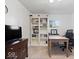 Bright office with built-in shelves, desk, and neutral decor at 9944 Holaday Dr, Carmel, IN 46032
