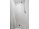 Bright shower with white subway tile and a mosaic tile floor at 9944 Holaday Dr, Carmel, IN 46032