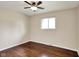Bedroom featuring hardwood floors, neutral paint, and a ceiling fan at 1043 E Castle Ave, Indianapolis, IN 46227