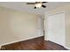Bedroom featuring hardwood floors and white closet doors at 1043 E Castle Ave, Indianapolis, IN 46227
