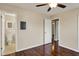 Bedroom featuring hardwood floors, ceiling fan and access to the bathroom and hallway at 1043 E Castle Ave, Indianapolis, IN 46227