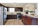 Bright kitchen with modern appliances and a view into the connected dining room at 1043 E Castle Ave, Indianapolis, IN 46227