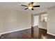 Living room with hardwood floors and a peek into the kitchen at 1043 E Castle Ave, Indianapolis, IN 46227