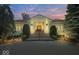 Elegant home entrance with a brick driveway, manicured shrubs and a classic door at 10919 Brigantine Dr, Indianapolis, IN 46256