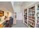 Charming home office with lots of shelves and storage featuring a big work space at 10919 Brigantine Dr, Indianapolis, IN 46256