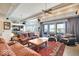 Open-concept living room with water views, adjacent kitchen, and comfortable seating area at 10919 Brigantine Dr, Indianapolis, IN 46256