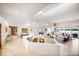 Open living space with staircase and views of lake, with tile floors at 10919 Brigantine Dr, Indianapolis, IN 46256