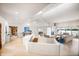 Open living space with staircase and views of lake, with tile floors at 10919 Brigantine Dr, Indianapolis, IN 46256