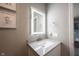 Stylish bathroom featuring a modern vanity with an illuminated mirror and neutral paint at 10982 Gate Cir, Fishers, IN 46038