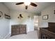 Bedroom showcasing a ceiling fan and decor on the walls, offering a comfortable and personalized space at 10982 Gate Cir, Fishers, IN 46038