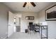 Bedroom featuring a gray carpet, workstation desk, and open doorway to the hallway, offering a versatile space at 10982 Gate Cir, Fishers, IN 46038