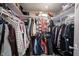 Walk-in closet with ample shelving and hanging space, perfect for organized storage of clothing and accessories at 10982 Gate Cir, Fishers, IN 46038