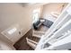 Bright foyer with high ceilings, wood floors, statement lighting, and a gray L-shaped couch at 10982 Gate Cir, Fishers, IN 46038