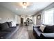 Open concept living room with hardwood floors, neutral walls, and an open concept design at 10982 Gate Cir, Fishers, IN 46038