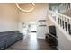 Spacious living room with hardwood floors, lots of light and a comfortable gray sofa at 10982 Gate Cir, Fishers, IN 46038