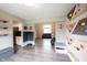Versatile playroom featuring a climbing wall and open access to the kitchen and living room at 10982 Gate Cir, Fishers, IN 46038