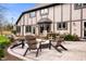 Backyard patio features a beautiful paver patio with chairs surrounding a fire pit at 1122 Mill Run Dr, Noblesville, IN 46062