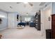 Spacious bedroom featuring carpet floors, ceiling fans and an organized bookshelf at 1122 Mill Run Dr, Noblesville, IN 46062