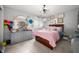 Light-filled bedroom features bright decor, modern furniture and comfortable bed at 1122 Mill Run Dr, Noblesville, IN 46062