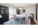 Eat-in kitchen with blue accent rug and french doors with a view to the yard at 1122 Mill Run Dr, Noblesville, IN 46062