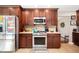 A full view of the kitchen featuring stainless steel appliances and granite countertops at 1122 Mill Run Dr, Noblesville, IN 46062