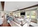 Spacious living room with beamed ceilings and a large sectional couch at 1122 Mill Run Dr, Noblesville, IN 46062