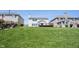 Spacious backyard with green lawn and view of the home's exterior at 11327 Guy St, Fishers, IN 46038