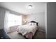 Cozy secondary bedroom with a bed, and large windows offering plenty of natural light at 11327 Guy St, Fishers, IN 46038