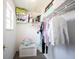 Well-organized closet with shelves, hanging clothes, and a toy box, providing efficient storage solutions at 11327 Guy St, Fishers, IN 46038