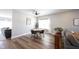 Cozy dining area with hardwood floors, modern lighting, and a view to the living space at 11327 Guy St, Fishers, IN 46038