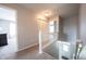 Hallway with railing leading to the front door, showing access to bedrooms at 11327 Guy St, Fishers, IN 46038