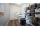 Functional laundry room with shelving, washer, and dryer at 11327 Guy St, Fishers, IN 46038