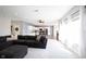 Living room with a sectional sofa that looks into the kitchen and dining area at 11327 Guy St, Fishers, IN 46038