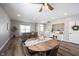 Bright living room featuring an oval dining table with wood floors and neutral decor at 11327 Guy St, Fishers, IN 46038