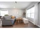 Spacious living room offers hardwood floors, neutral tones, and abundant natural light at 11327 Guy St, Fishers, IN 46038