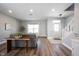 Open-concept living room boasts hardwood floors, neutral tones, and plenty of natural light at 11327 Guy St, Fishers, IN 46038