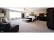 Spacious main bedroom with a ceiling fan, carpet floors, and large windows that provide plenty of natural light at 11327 Guy St, Fishers, IN 46038