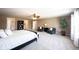 Open main bedroom features two chairs, large potted plant, and a ceiling fan for added comfort at 11327 Guy St, Fishers, IN 46038