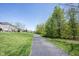 Scenic walking path winding through green lawns and trees, perfect for outdoor enjoyment at 11327 Guy St, Fishers, IN 46038